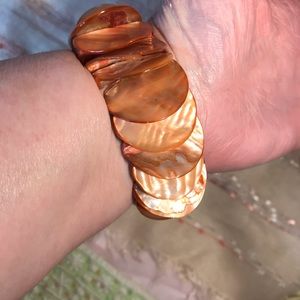 Two dyed abalone shell bracelets